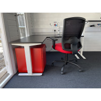 Bespoke portland HD chair with a height adjustable L shape desk and red bisley pedestal